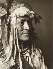 Edward S. Curits Native American Indians - Hidatsa Indian White Duck, head and shoulders, wearing headdress ca.1908.