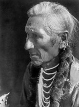 Edward S. Curits Native American Indians - Photograph shows Flathead man, head-and-shoulders portrait, facing left circa 1910.