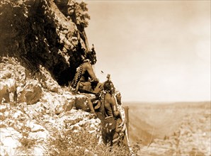 Edward S. Curtis Native American Indians - Native Americans looking out over the plains from the side of a cliff circa 1905.