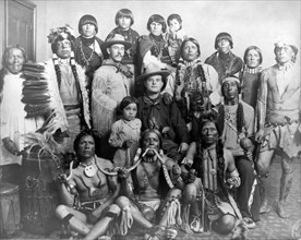 Edward S. Curtis Native American Indians - Group of Pueblo Indians, three men in front holding snakes, two Caucasian men in center circa 1905.
