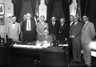 Franklin D. Roosevelt - President Roosevelt signs small home loan measure. President Roosevelt today signed the bill providing for a $2,000,000,000 refinancing of small home mortgages to put them on l...
