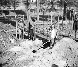 'A' boss is shown here instructing a transient worker in ditch digging at 'Tugwelltown,' a.k.a. Greenbelt, Maryland circa October 1935.