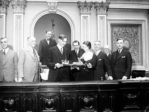 Congress, U.S. Capitol - Congressmen holding tray of what appears to be drinks, Washington, D.C. circa 1932 .