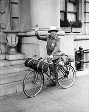 Henry G. Slaughter riding his bicycle circa 1935.