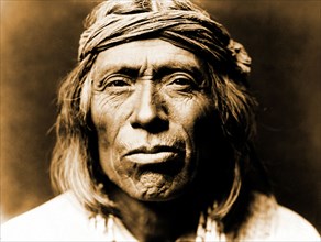 Edward S. Curtis Native American Indians - portrait of Shiwawatiwa, a Zuni Indian circa 1903.