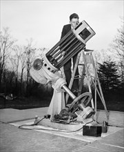 Telescope built in the Newtonian configuration with one axis of the mount polar-aligned for tracking the sky circa 1936.