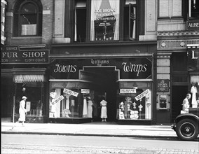 Washington D.C. History - View of businesses: Joe Brown Theatrical Enterprises and Williams Shops, Gowns, Wraps circa 1935 .