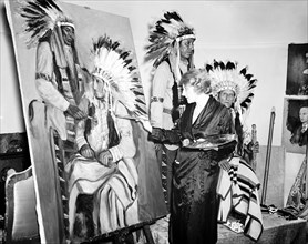 Woman artist Painting portraits of Native Americans circa 1936.