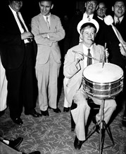 Congressional musicians, gave the House a treat last night, by playing a number of old tunes. Congressman playing drums and smoking cigar 8/27/35.