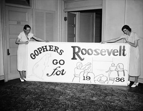 Two women holding a Gophers go for Roosevelt sign circa 1936.
