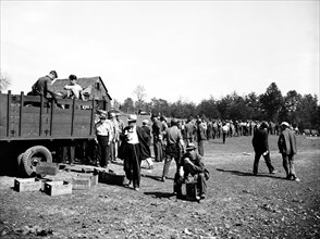 Workers at Tugwelltown (Greenbelt Maryland) take a lunch break circa October 1935.