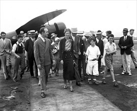 Amelia Earhart among group of people circa 1932.