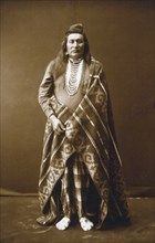 Edward S. Curtis Native American Indians - Full-length portrait of a Nez Percé man circa 1899.