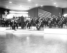This photograph shows a portion of the U.S. Navy Band's 95-piece symphony orchestra for the first time -  photo taken 11/25/1935.