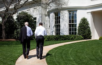 President Barack Obama and Vice President  Joe Biden walk back to the Oval Office after putting on the White House putting green April 24, 2009..