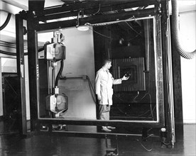 Jay Prendergast adjusts the lens on a Robertson 48-inch, 4.5 ton camera. Installed in 1959, the camera was used for precise scale transformation of mapping separates and composites. This photo was tak...