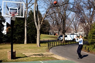President Barack Obama shoots hoops on the White House South Lawn basketball court 3/6/09..