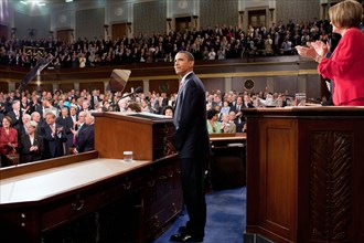 President Barack Obama looks towards the First Lady and guests seated in the gallery of the House Chamber at the U.S. Capitol in Washington, D.C., Sept. 9, 2009..