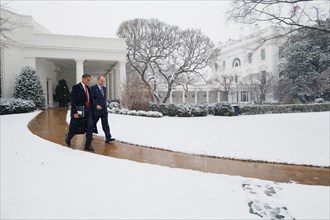 President Barack Obama leaves the White House with his Legislative Affairs Director Phil Shiliro en route the U.S. Capitol to meet with  Republican members of Congress, 1/27/09. .