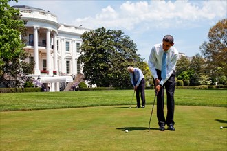 President Barack Obama and Vice President  Joe Biden practice their putting on the White House putting green April 24, 2009. .