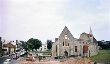Cars parked outside Royal Garrison Church in Portsmouth England circa 1973 (originally built in 1212).