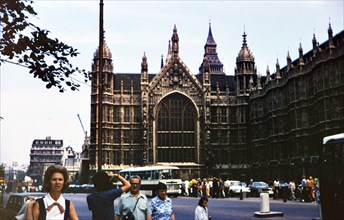 Pedestrians outside the Parliament Building in London circa 1973.