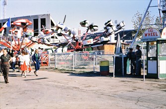 Amusement carnival rides at the Texas State Fair circa 1954-1956.