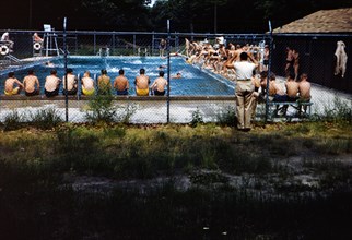 Early 1950s boys at a community swimming pool (boys only) circa 1950-1955.