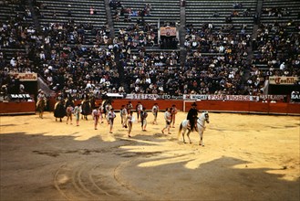 Parade of the bull fighters at the beginning of a bull fight in Mexico circa 1950-1955.