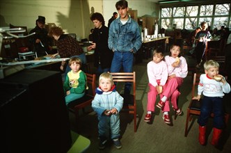 East German children enjoy a snack at the refugee center in West Berlin..