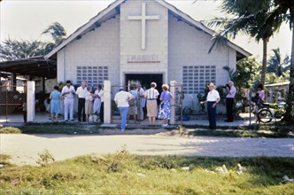 (R) People outside a small church in Honduras circa 1987.