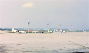 1972 (R) -  Airplanes on the tarmac at an airport in Europe (probably Orly in Paris).