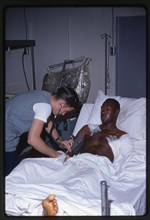 Corpsman Treats Wounded Marine