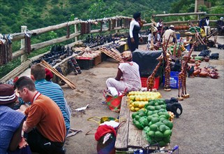 March 2000 - Local merchants sells fruits and crafts at a roadside stand located near Air Force Base