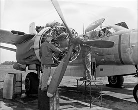 Airman works on a B-26 aircraft