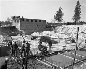 Construction workers pour cement in 1942 at Camp McCoy