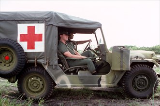 1978 - US Army medics stand by in an M718A1 ambulance.