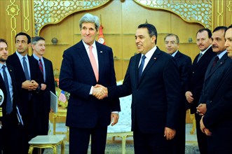 2014 - Secretary Kerry is Greeted by Tunisian Prime Minister Joma'a in Carthage.