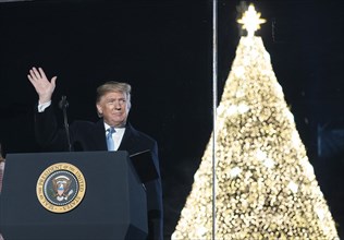 President Donald Trump waves to the crowd at the National Christmas Tree Lighting 2019 ceremony Thursday