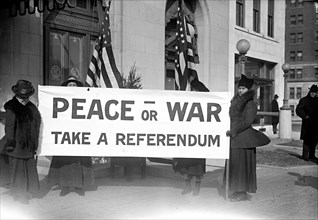 Pacifists holding Peace or War banner