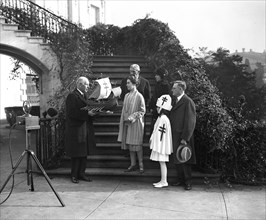 1928 - Mrs. Coolidge is presented with original ship model for the 1928 Xmas seals.