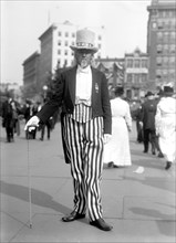 Man dressed as Uncle Sam at a parade in 1916.