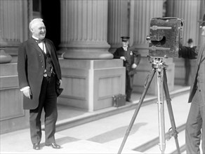 North Carolina Senator Lee Overman standing before a movie camera