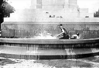 Children playing in a water fountain
