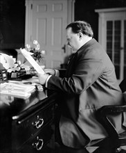 President William Howard Taft sitting at his desk