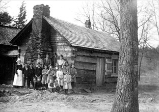 Large family of 15 mountaineers at their cabin in rural United States