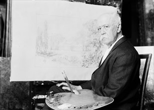 Artist John Ross Key in a studio painting