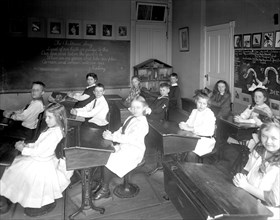 Students sitting in desks at the Potomoc School