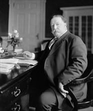 President William Howard Taft sitting at his desk