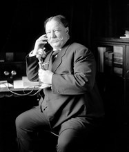 William Howard Taft talking on telephone